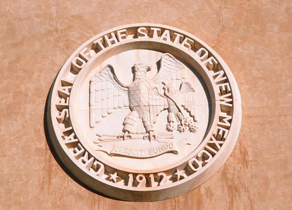 New Mexico State seal on side of building