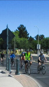 People on the street riding bikes
