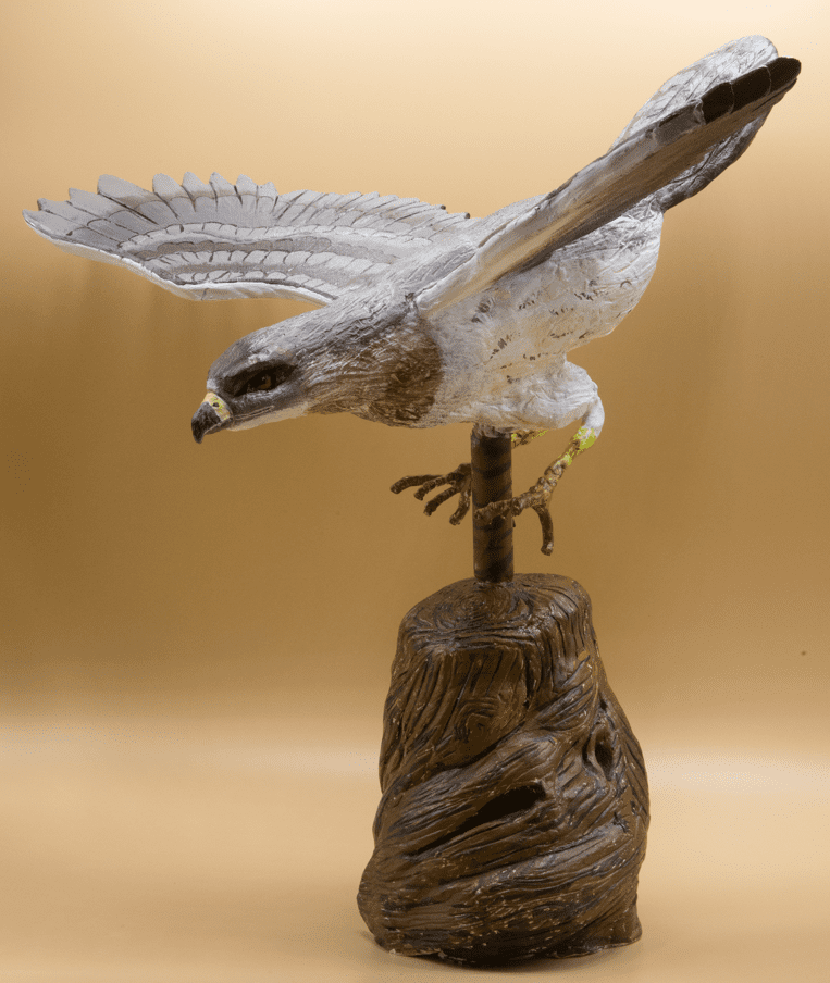 Statue of a bird flying.