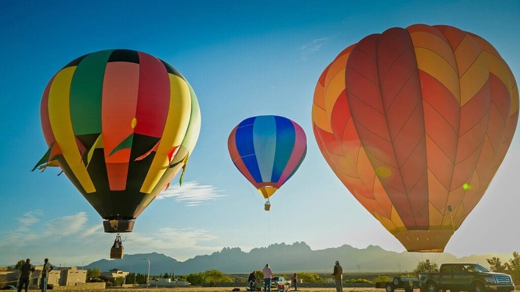 Three hot air balloons in the sky.