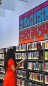 woman looking at books in the library