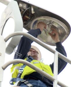 man working on a street light