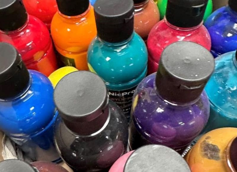 A picture of assorted paint bottles