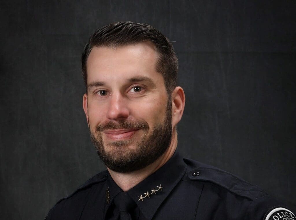 A photo of a male wearing a police uniform