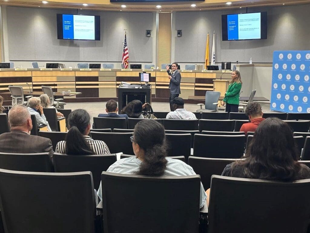 Man speaking to an audience.