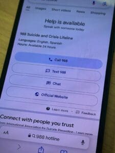 Cell phone with Suicide and Crisis Hotline information