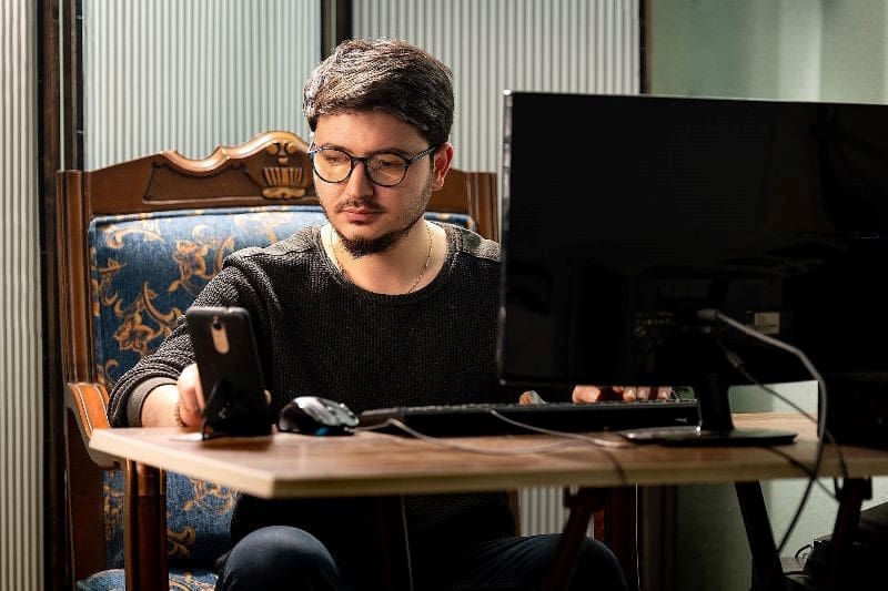 Man working on a computer.