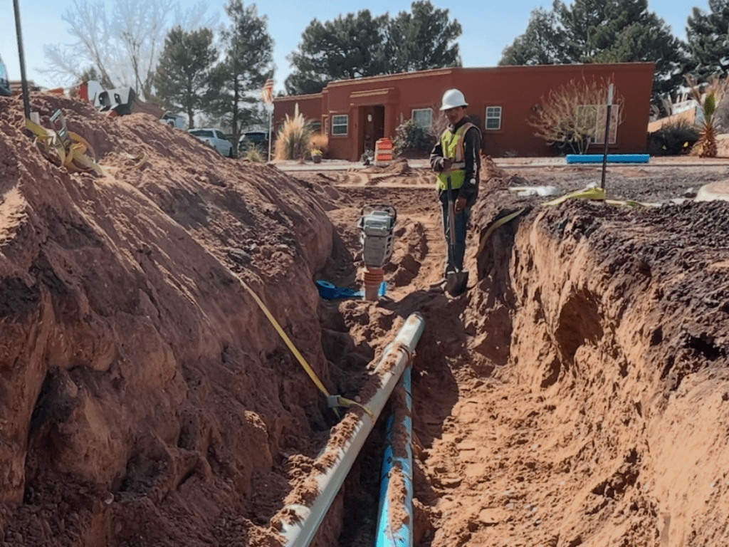 Man standing in a trench.