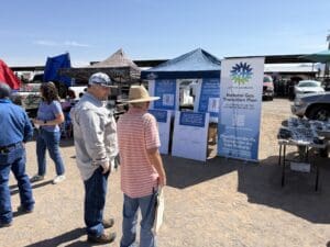 People talking in front of pop up meeting 