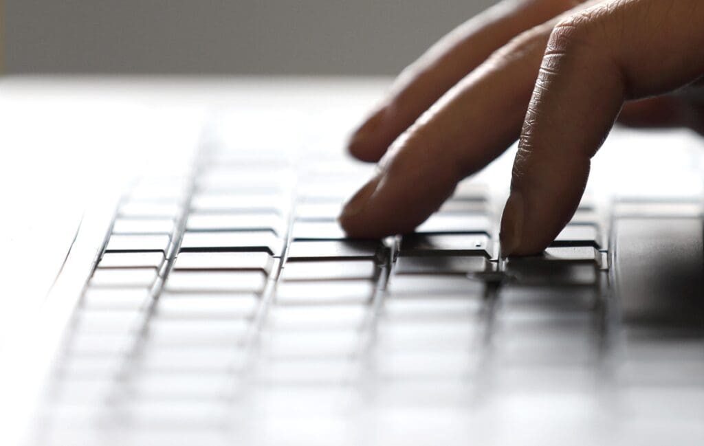 Fingers typing on a keyboard