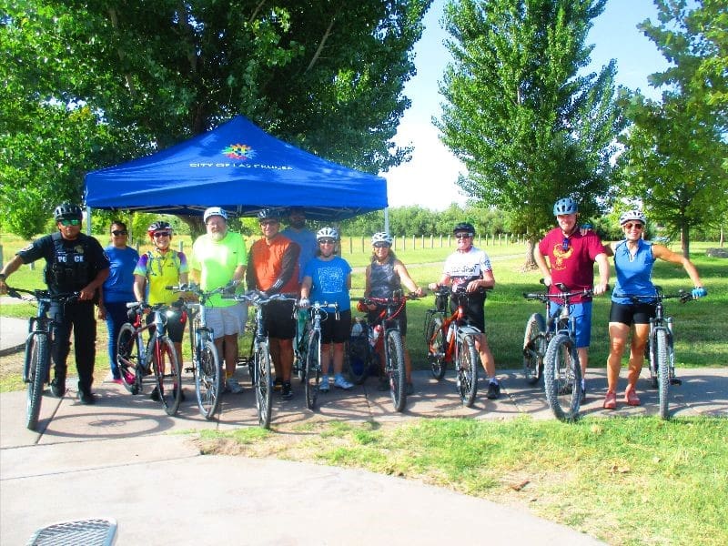 Several bicyclists at a park.