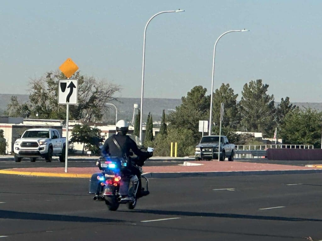 LCPD motorcycle unit driving down the road.