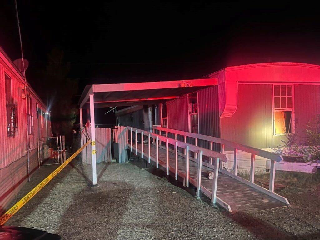 Front of a mobile home in the night.