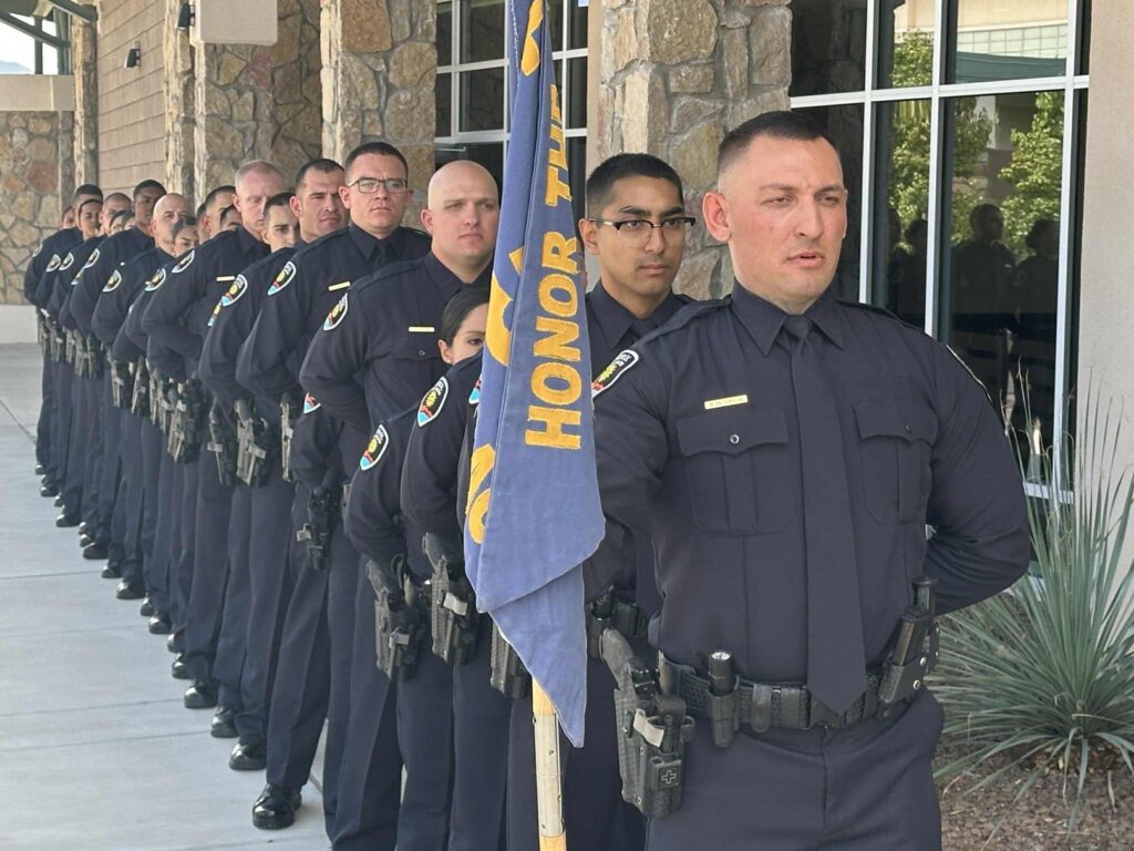 A group of police cadets standing in a line.