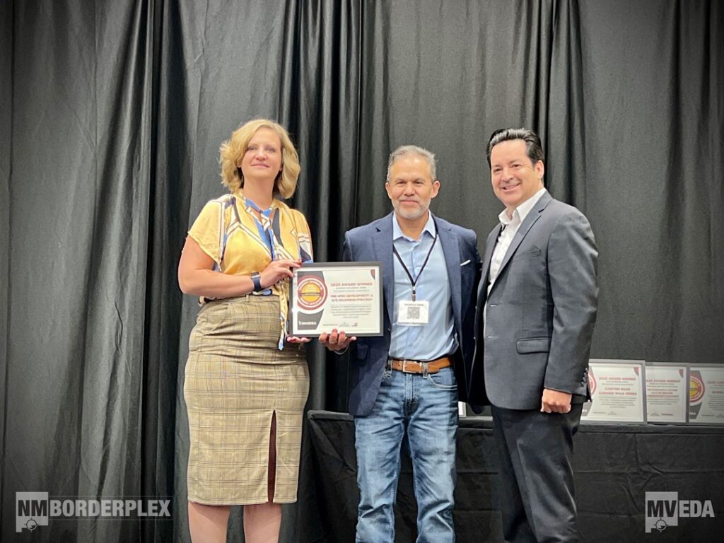 photo of a three people receiving an award