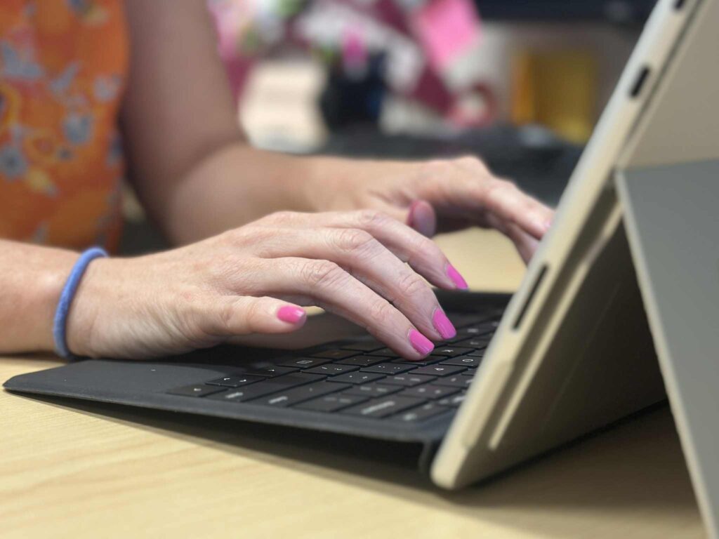 photo of a person on a laptop