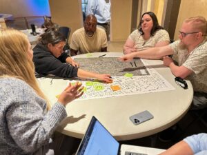 Community participants review maps and make notations of downtown’s challenges and opportunities.