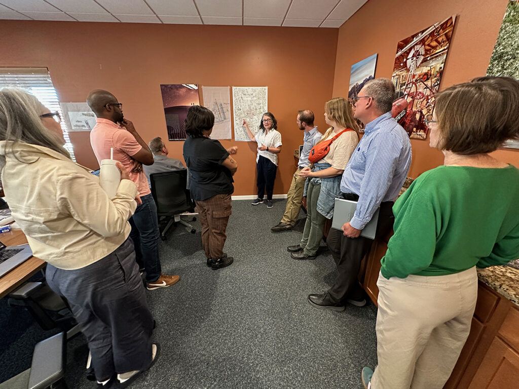 Project lead, Susan Henderson, describes work-in-progress to city staff during the mid-week pin-up.