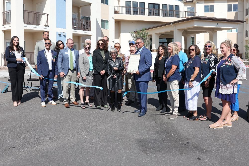 photo of a group of people in front of apartments