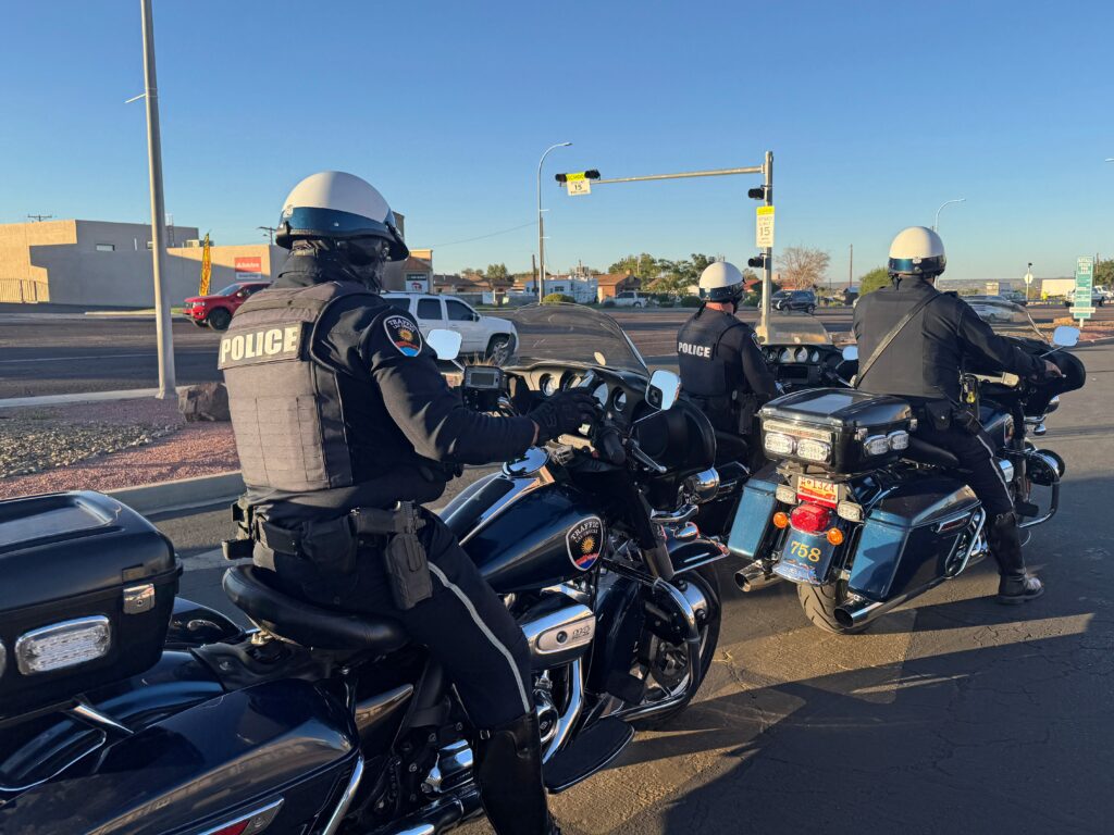 Police officer sitting on his motorcycle conducting radar.