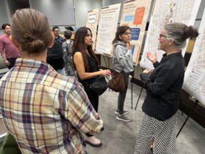 PlaceMaker consultant representative Susan Henderson explains the proposed master plan to meeting attendees. 