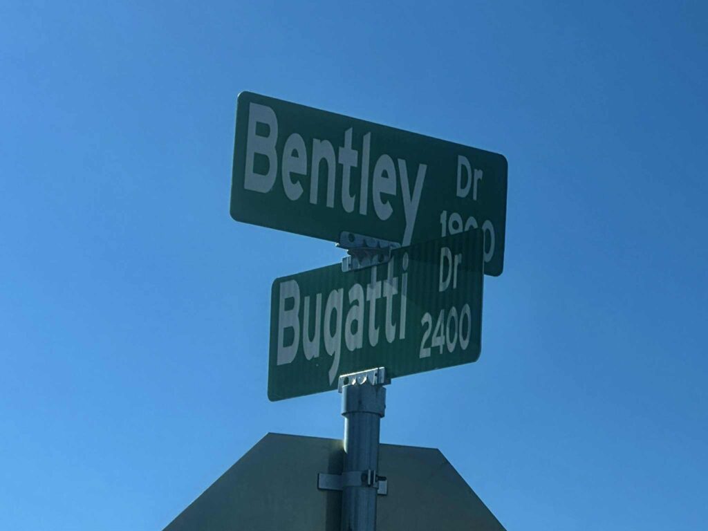 Street sign at the corner of Bently Drive and Bugatti Drive
