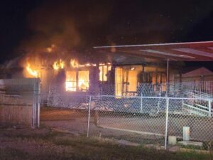 House engulfed in flames.