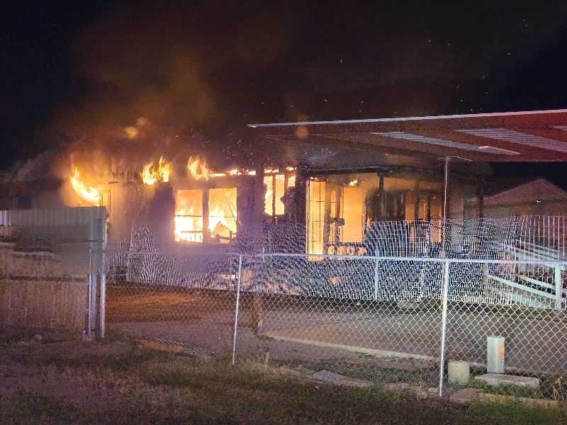 House engulfed in flames.