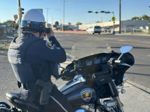 Officer talking to someone in a truck.