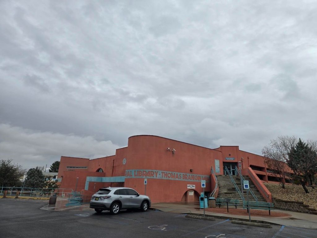 The outside of Branigan Library with one vehicle in the parking lot.