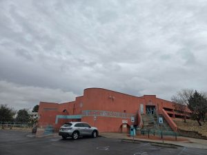 The outside of Branigan Library with one vehicle in the parking lot.