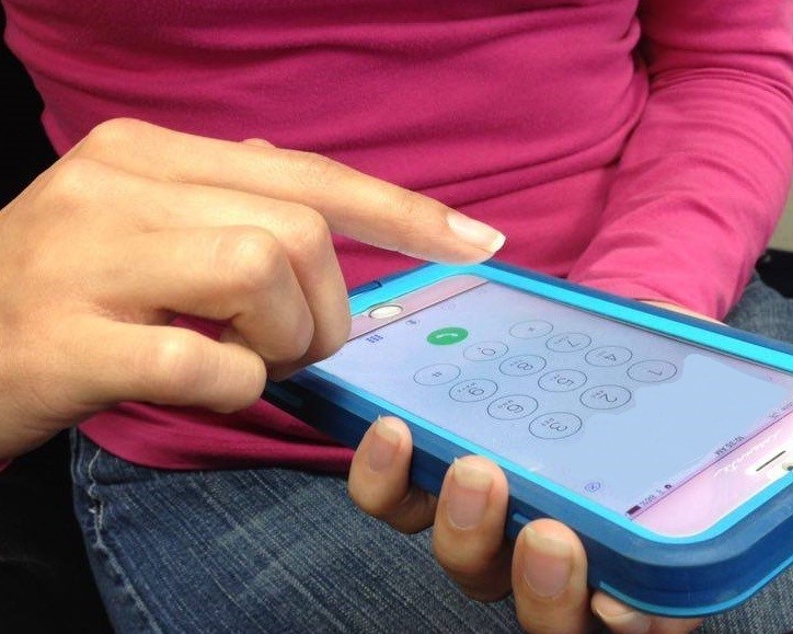 Someone holding a cell phone.