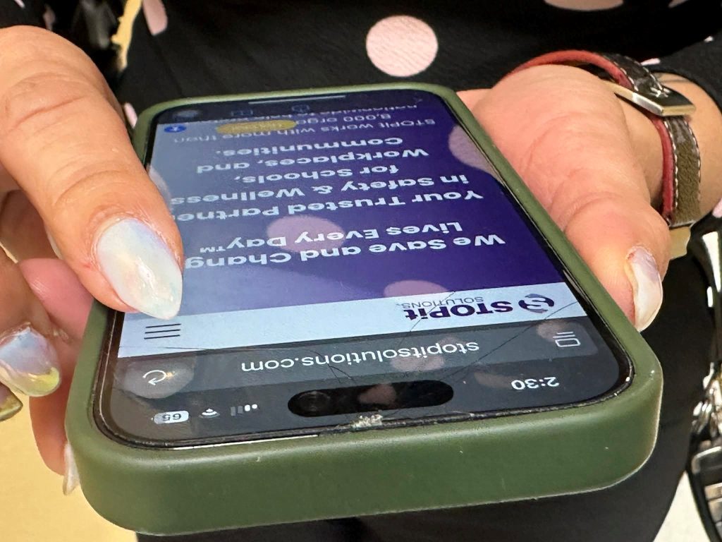 Two hands holding a cell phone.