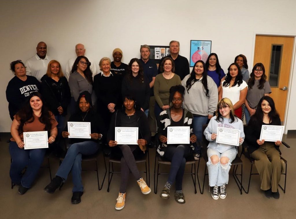 Group of graduates from Citizens' Police Academy together with their certificates.