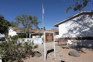Eastside Community Center sign with the building in the background in Las Cruces. Building located at 310 North Tornillo according to the writing on the sign.