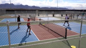 Pickle ball courts in las Cruces with people playing on them.