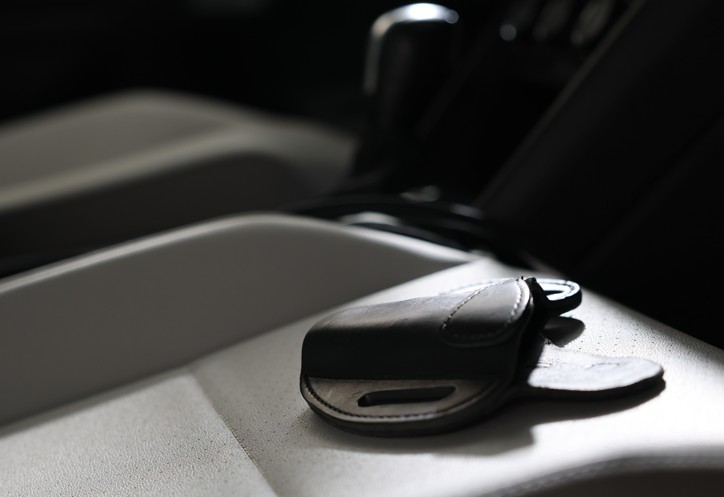 An empty gun holster on the seat of a car