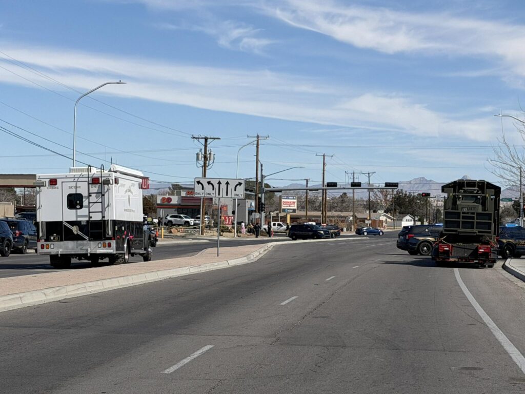 Police vehicles blocking an intersection.