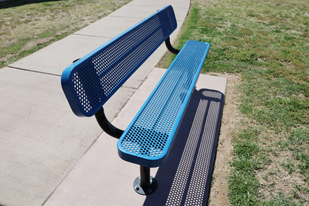 Close up of new blue benches at La Llorona Park.