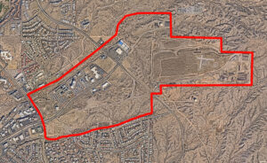 Map displaying a red line around the approximate area of the East Lohman Development Plan. Plan area is located south of East Lohman Ave, between Roadrunner Pkwy and Sonoma Ranch Blvd. It is located across the street from Mountainview Hospital.