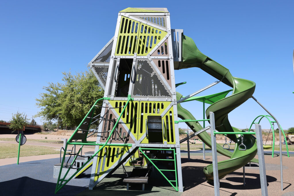 Playground tower feature at La Llorona Park with ways to climb up and fit securely inside.