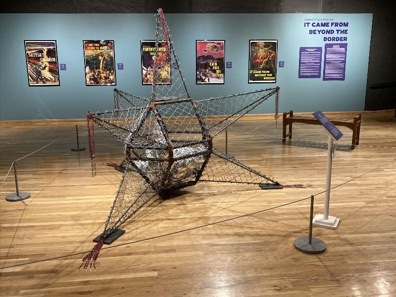 Wire sculpture in the middle of a room.
