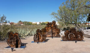 Metal cacti in bronze patina. When viewed from other angle, cacti change to quail.