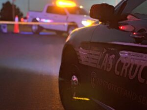 Front of a police vehicle in front of a truck .
